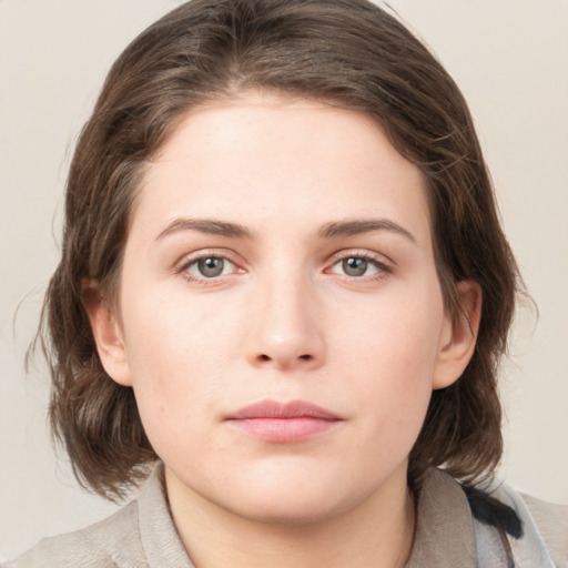 Neutral white young-adult female with medium  brown hair and grey eyes