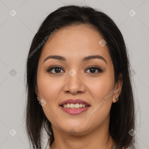 Joyful latino young-adult female with medium  brown hair and brown eyes