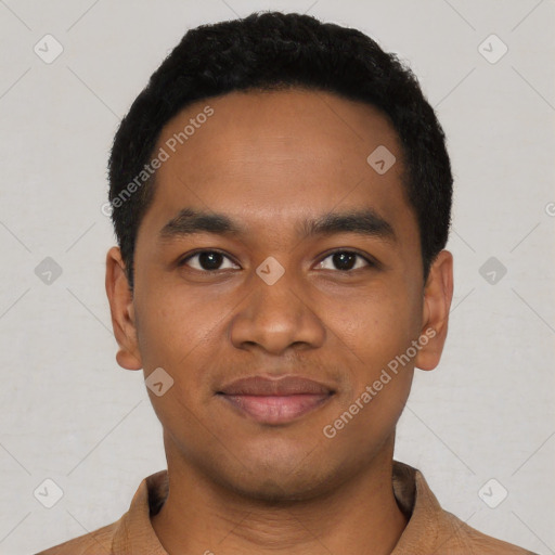 Joyful black young-adult male with short  black hair and brown eyes