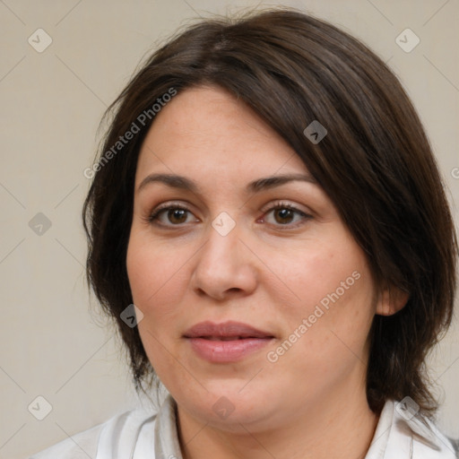 Joyful white adult female with medium  brown hair and brown eyes