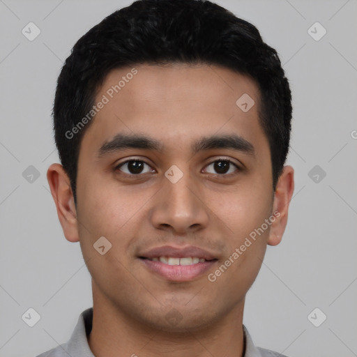 Joyful latino young-adult male with short  black hair and brown eyes