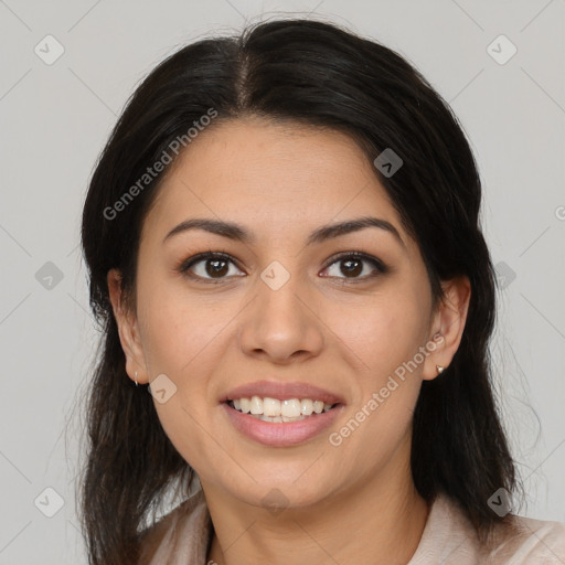 Joyful latino young-adult female with medium  brown hair and brown eyes