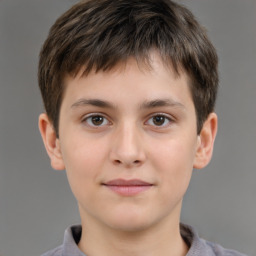 Joyful white child male with short  brown hair and brown eyes