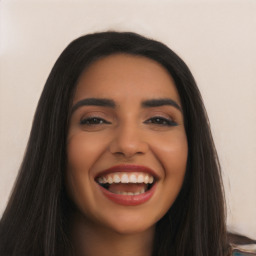 Joyful latino young-adult female with long  black hair and brown eyes