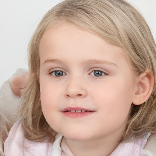 Joyful white child female with medium  brown hair and blue eyes