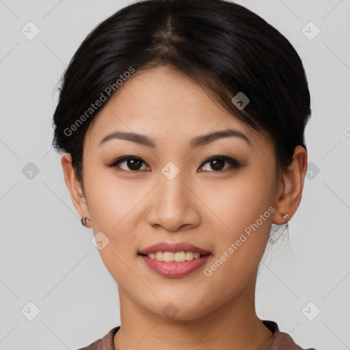 Joyful asian young-adult female with short  brown hair and brown eyes