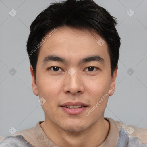 Joyful asian young-adult male with short  black hair and brown eyes