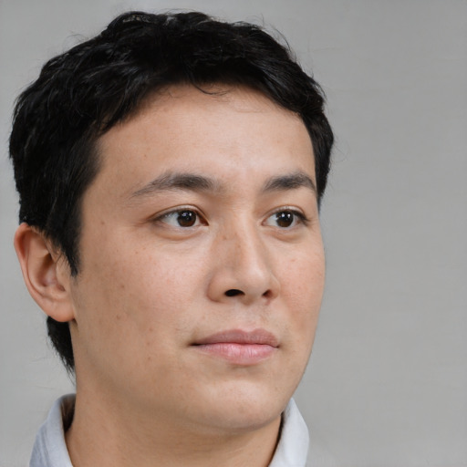 Neutral asian young-adult male with short  brown hair and brown eyes