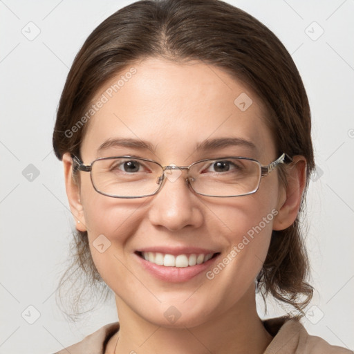 Joyful white young-adult female with medium  brown hair and grey eyes