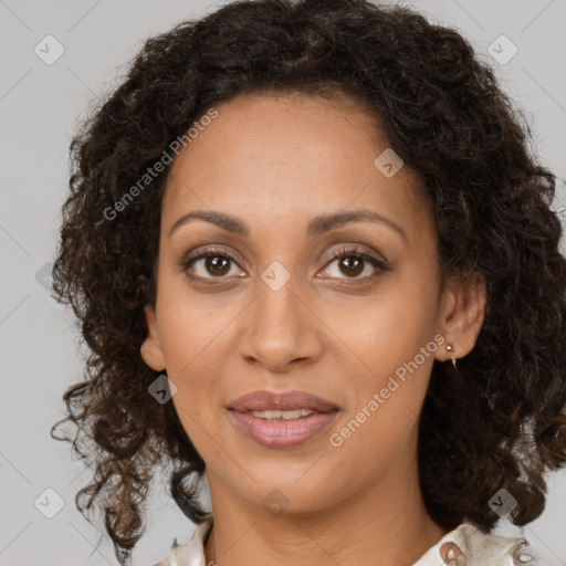 Joyful latino adult female with medium  brown hair and brown eyes