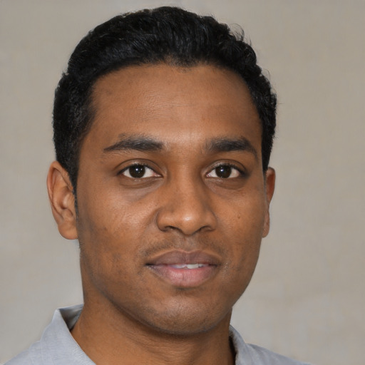 Neutral black young-adult male with short  black hair and brown eyes