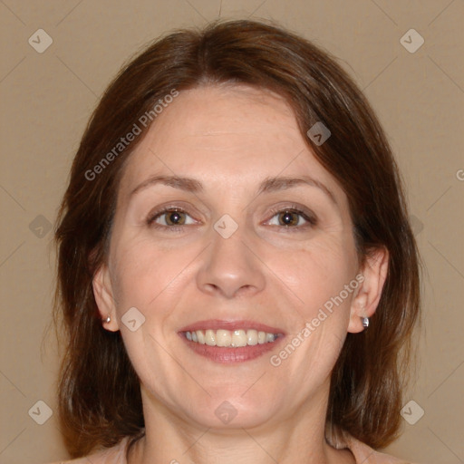 Joyful white adult female with medium  brown hair and brown eyes