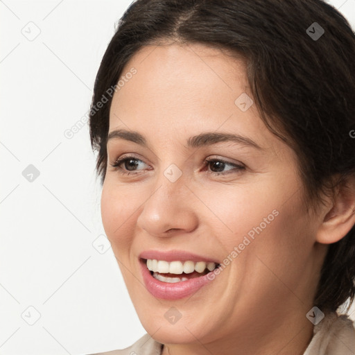 Joyful white young-adult female with medium  brown hair and brown eyes