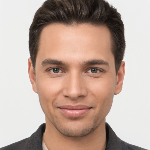 Joyful white young-adult male with short  brown hair and brown eyes