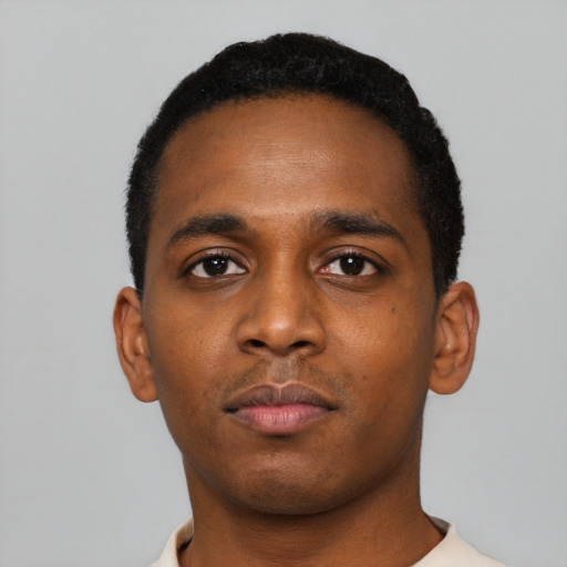 Neutral black young-adult male with short  black hair and brown eyes