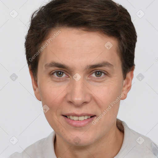 Joyful white adult male with short  brown hair and brown eyes