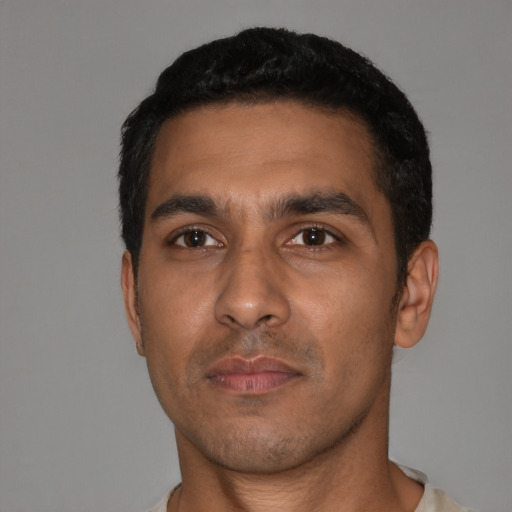 Neutral latino adult male with short  black hair and brown eyes