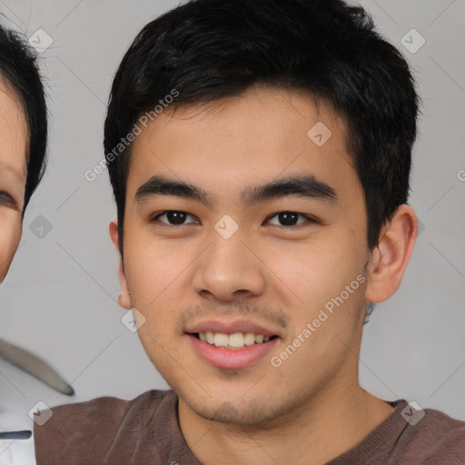 Joyful white young-adult male with short  black hair and brown eyes