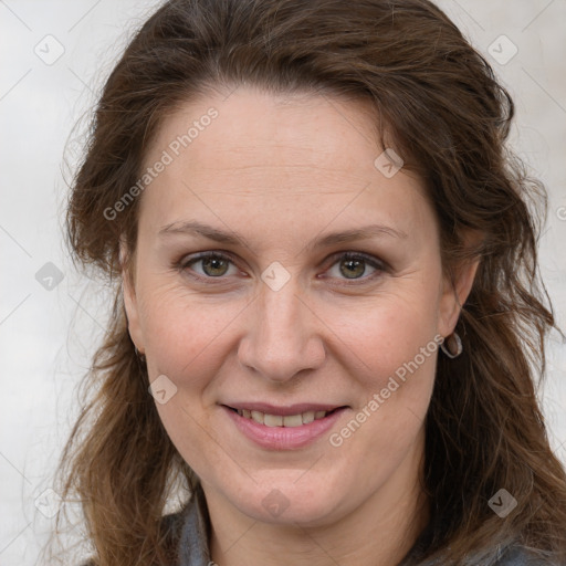 Joyful white adult female with long  brown hair and brown eyes