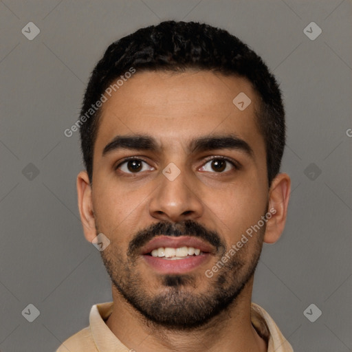 Joyful latino young-adult male with short  black hair and brown eyes