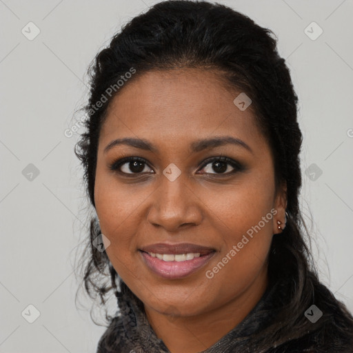 Joyful black young-adult female with long  brown hair and brown eyes