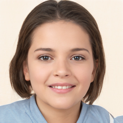 Joyful white child female with medium  brown hair and brown eyes