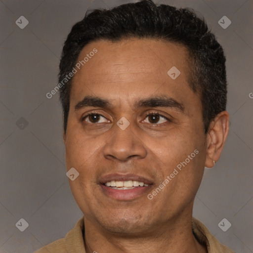Joyful latino adult male with short  black hair and brown eyes