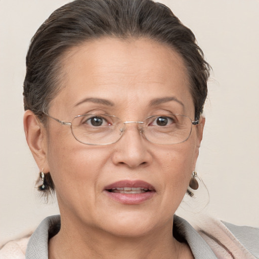 Joyful white middle-aged female with short  brown hair and brown eyes