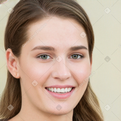 Joyful white young-adult female with long  brown hair and grey eyes