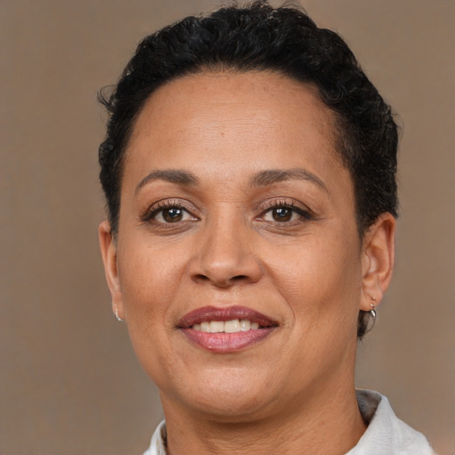 Joyful white adult female with short  brown hair and brown eyes