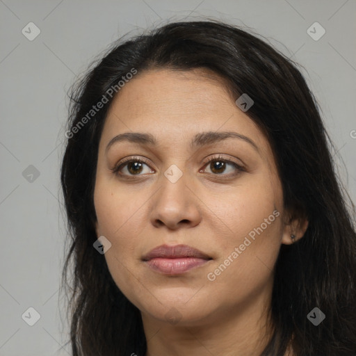 Joyful latino young-adult female with long  brown hair and brown eyes
