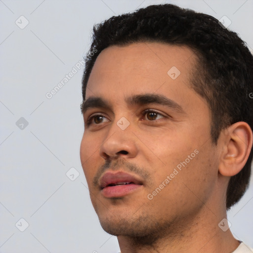 Neutral latino young-adult male with short  black hair and brown eyes