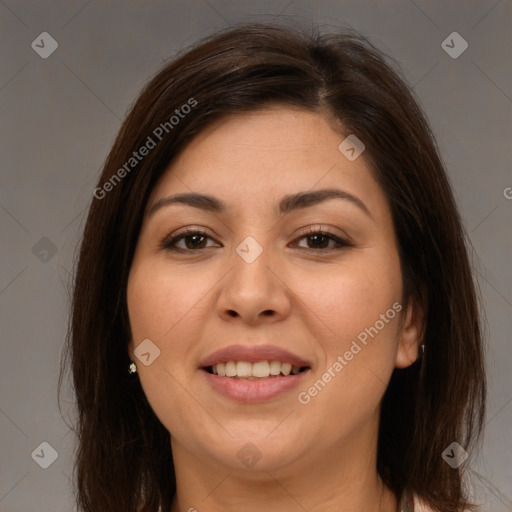 Joyful white young-adult female with long  brown hair and brown eyes