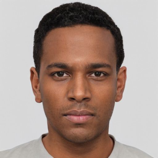 Neutral black young-adult male with short  black hair and brown eyes