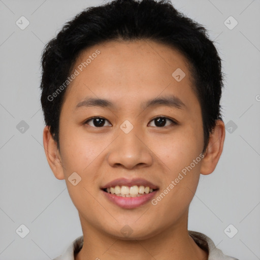 Joyful asian young-adult male with short  brown hair and brown eyes