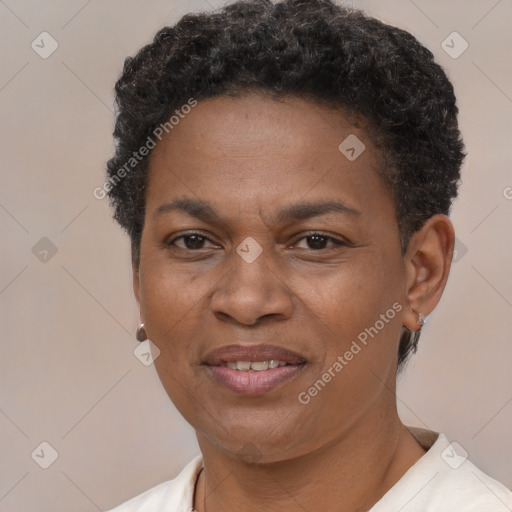 Joyful black adult female with short  brown hair and brown eyes