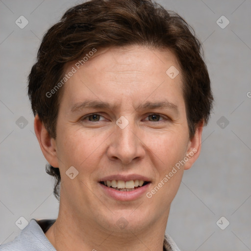 Joyful white adult male with short  brown hair and grey eyes