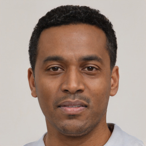 Neutral black young-adult male with short  black hair and brown eyes