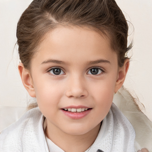 Joyful white child female with medium  brown hair and brown eyes