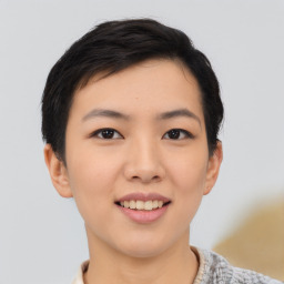 Joyful asian young-adult female with short  black hair and brown eyes