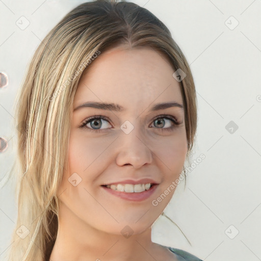 Joyful white young-adult female with long  brown hair and blue eyes