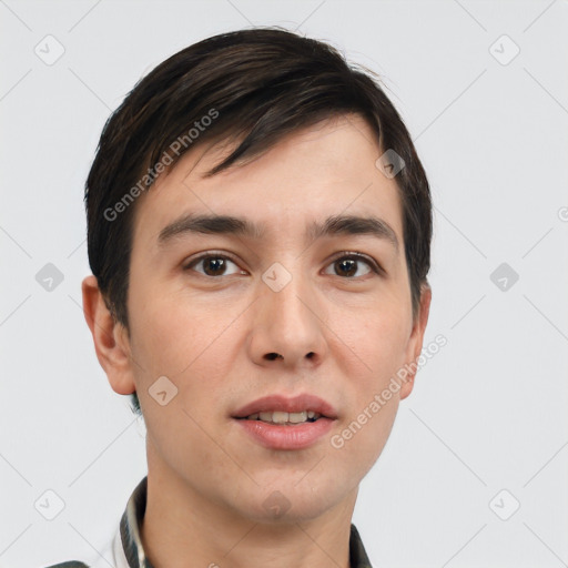 Joyful white young-adult male with short  black hair and brown eyes