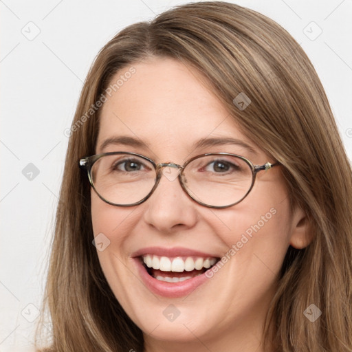 Joyful white young-adult female with long  brown hair and grey eyes