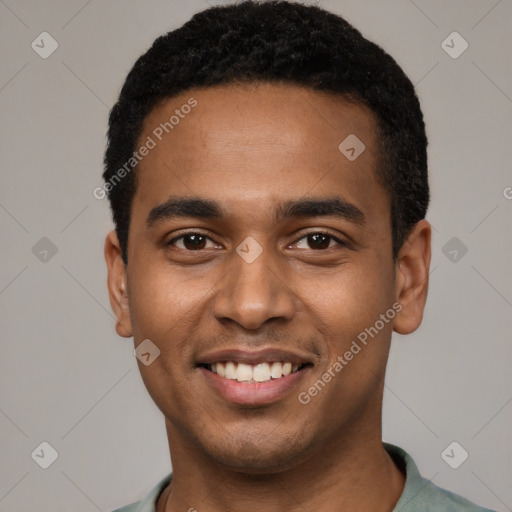 Joyful black young-adult male with short  black hair and brown eyes