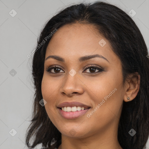 Joyful latino young-adult female with long  brown hair and brown eyes