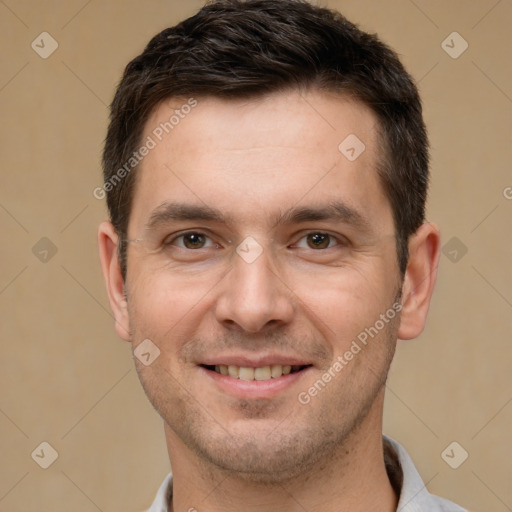 Joyful white adult male with short  brown hair and brown eyes