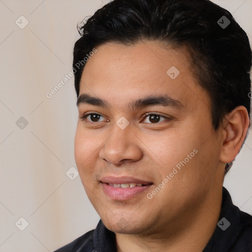 Joyful white young-adult male with short  black hair and brown eyes