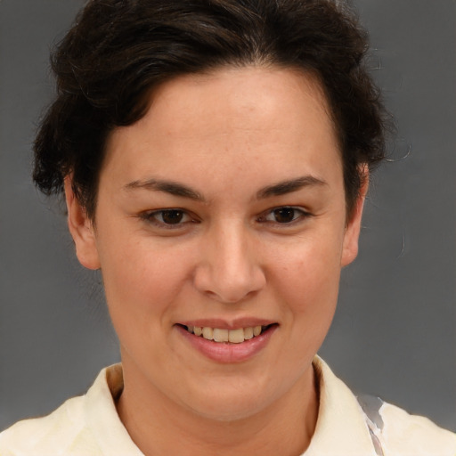 Joyful white adult female with short  brown hair and brown eyes