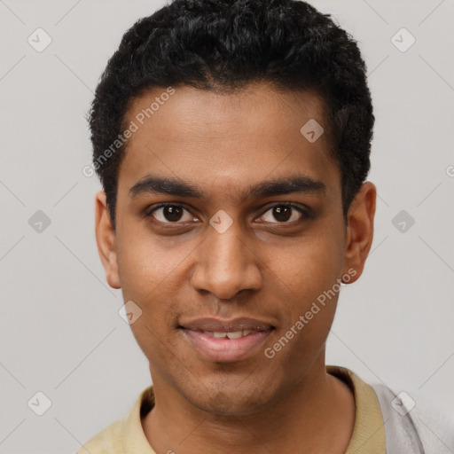 Joyful black young-adult male with short  black hair and brown eyes