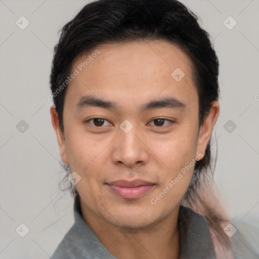 Joyful asian young-adult male with short  black hair and brown eyes